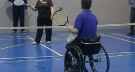 People with disabilities playing tennis