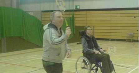 Person playing badminton